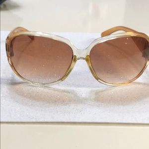 Large frame golden colored sunglasses